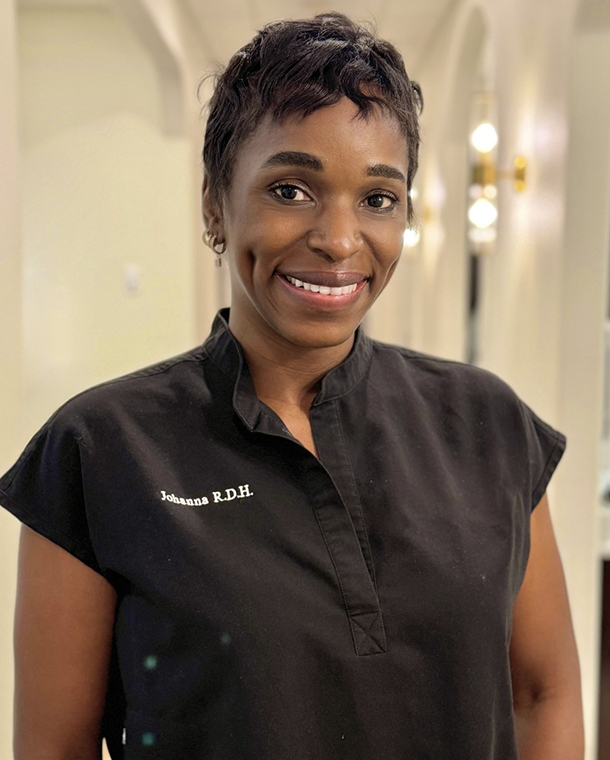 Smiling dental professional in black scrubs at Bethany Heights Dental Care office